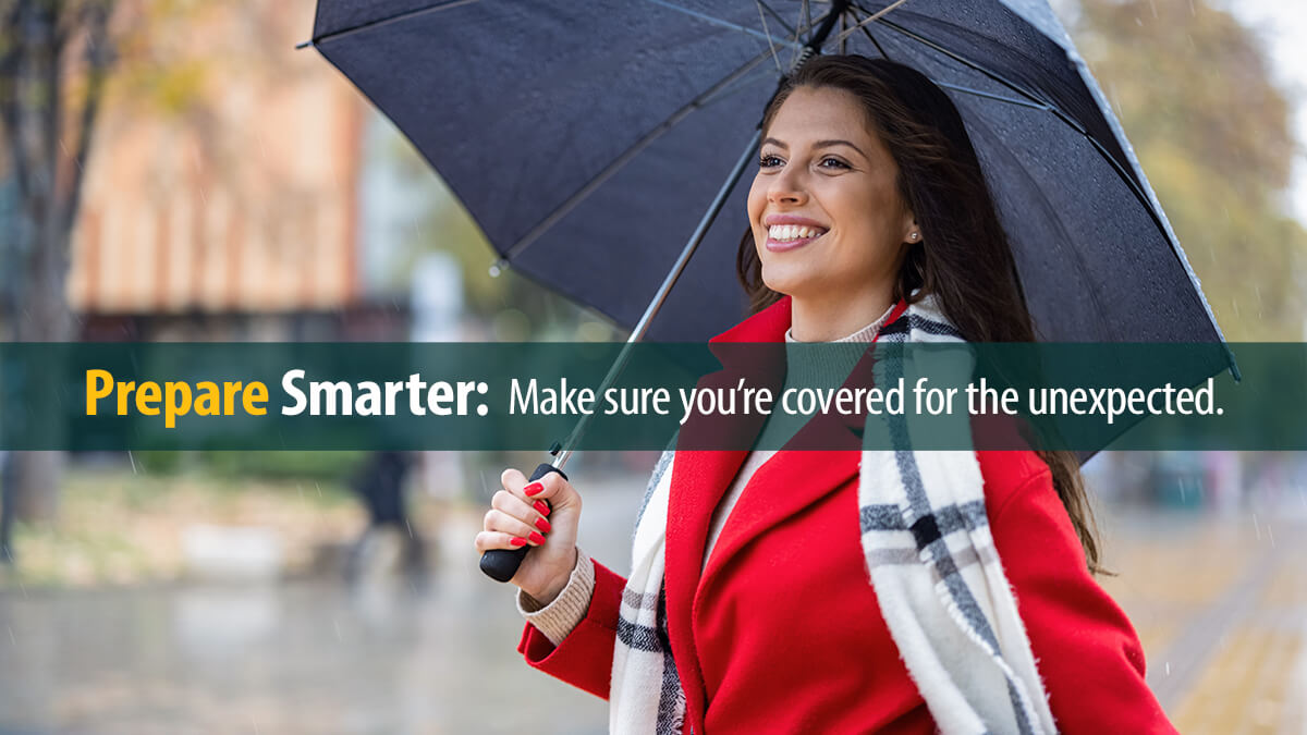 Smiling woman walking in the rain.